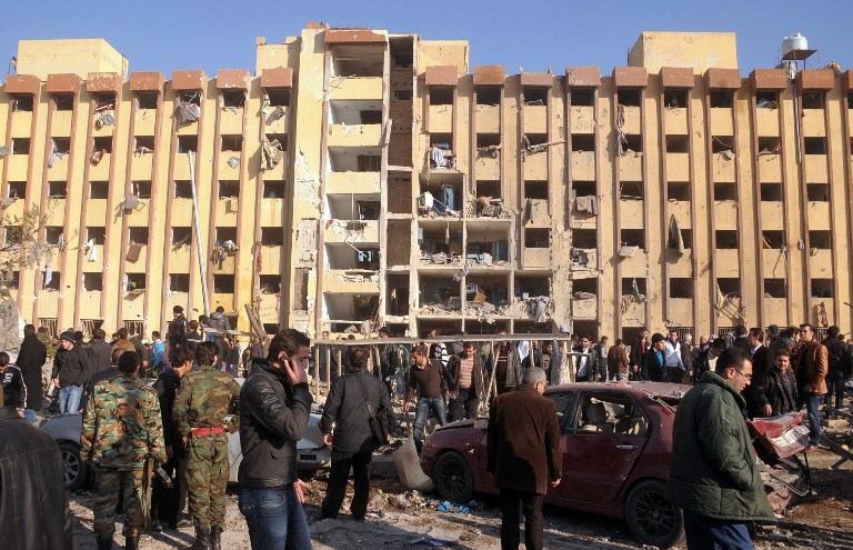 CAMPUS BLAST. Syrian's gather at the scene of an explosion outside Aleppo University, between the university dormitories and the architecture faculty, on January 15, 2013. AFP PHOTO/STR