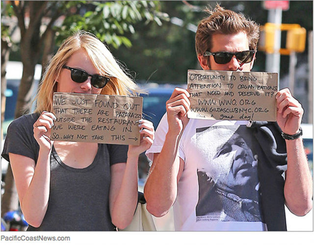 GOOD GAL EMMA, GOOD GUY ANDREW. What's a celeb to do when you're hounded by paparazzi? Use the media exposure to promote charities, of course. Photo from E!Online.