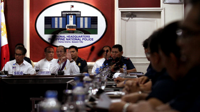 PURISIMA STAYS. President Benigno Aquino III (center) defends PNP Chief Alan Purisima (right) from calls for Purisima to resign. File photo by Rey Baniquet/Malacañang Photo Bureau