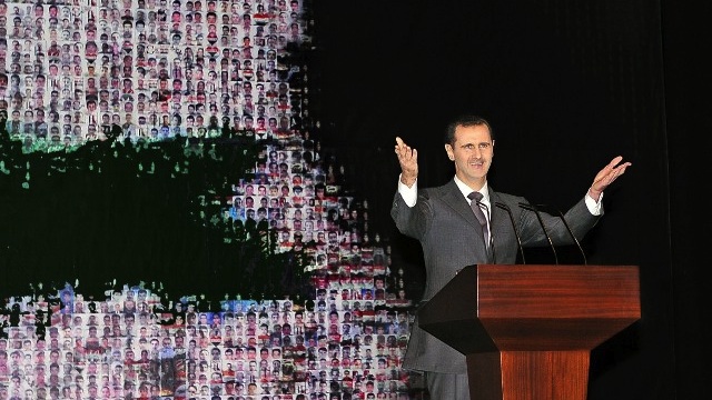 A handout picture released by the official Syrian Arab News Agency (SANA) shows Syria's embattled President Bashar al-Assad making a public address on the latest developments in the country and the region on January 6, 2013 at the opera house in Damascus. AFP PHOTO/ SANA