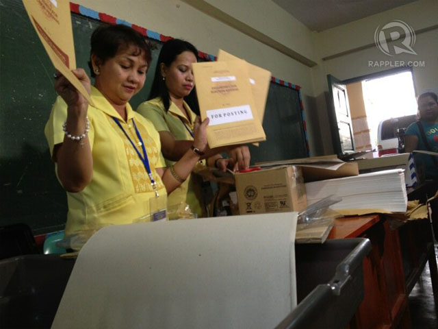 AT CRAME. Comelec team starts to set up and check election paraphernalia. Photo by Paterno Esmaquel II