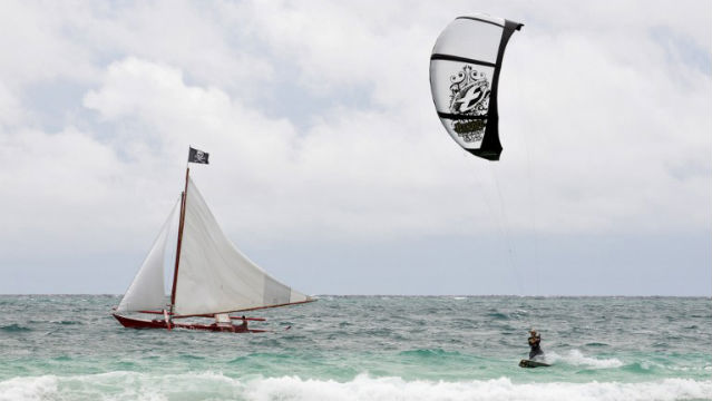 FAVORITE DESTINATION. A tourist enjoys kite boarding in the waters of Boracay island. File photo by Jay Directo/AFP 