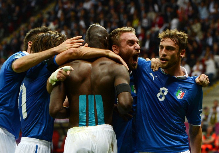 SUPERSTAR. Italian forward Mario Balotelli (C) celebrates with teammates after scoring his second goal during the Euro 2012 football championships semi-final match Germany vs Italy . June 28, 2012. AFP.
