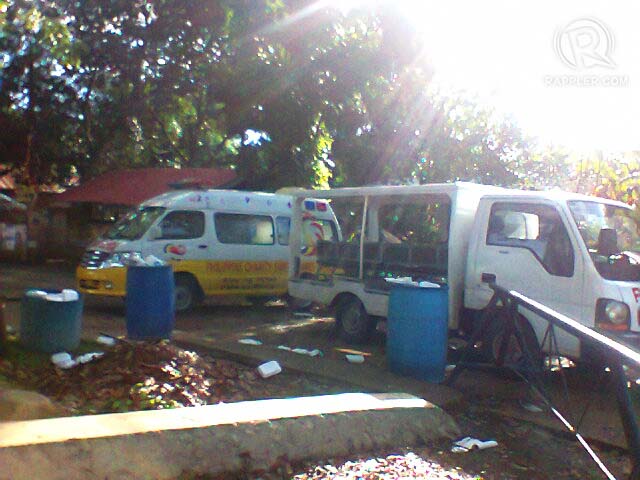 OFFICIAL BUSINESS? An ambulance and a police vehicle are used to prevent entry to the town hall of Kauswagan, Lanao del Norte. Contributed photo