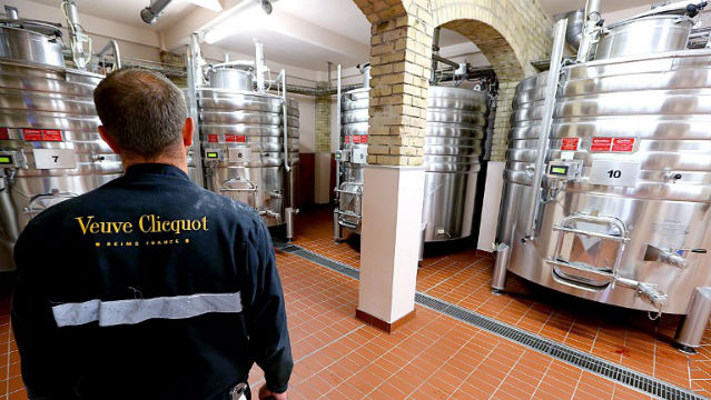 BOOZY? A man stands in front of tanks filled with red wine, used to manufacture pink champagne, in the vatroom of the Veuve Clicquot Champagne House, in Bouzy. AFP Photo