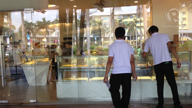BUSINESS AS USUAL. A Bread Talk retail store in Market!Market! shopping mall across Serendra residential and commercial complex prepares to open after a blast incident. Photo by Angela Casuay/Rappler