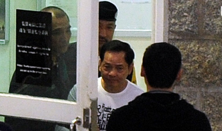 FREEDOM. Wan Kuok-koi (white), known as Broken Tooth, leaves Macau prison on December 1, 2012. The release from jail of Wan, a triad boss known as Broken Tooth, is fuelling speculation that the Chinese gambling playground of Macau could be on the verge of a return to the vicious gang violence of its colonial past. AFP file photo by Laurent Fievet