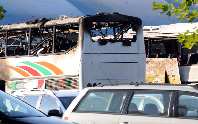 BUS BLAST. A picture shows destroyed buses after a bomb explosion at Bourgas airport on July 18, 2012. Three people were killed and more than 20 wounded on Wednesday in an apparent bomb attack on a bus packed with Israeli passengers at a Bulgarian airport, officials said, with media saying the toll would rise. AFP PHOTO / BULFOTO