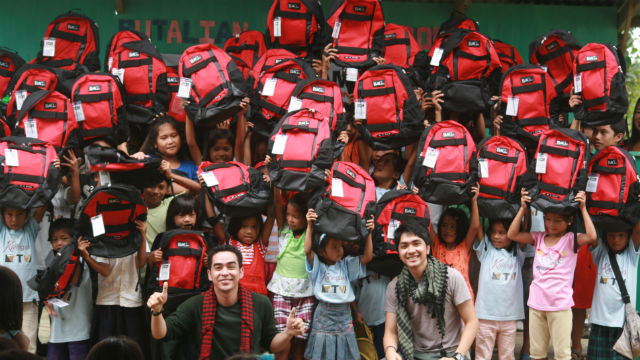 PAY IT FORWARD. Mindanao school children are excited to receive their new bags