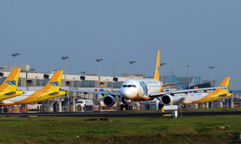 A Cebu Pacific plane taxiis at the terminal 3 of the international airport in Manila on October 17, 2012. AFP PHOTO/TED ALJIBE