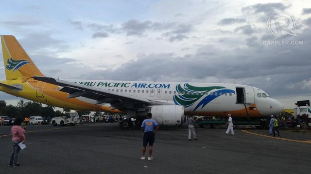 TOWED AWAY. The Cebu Pacific aircraft is cleared away from the Davao international airport runway. Photo by Karlos Manlupig/Rappler
