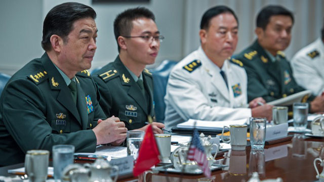 CHINA WON’T ACT FIRST. File photo shows Chinese Minister of National Defense Gen Chang Wanquan (left) and his staff attend at a meeting in Washington, DC in August last year. AFP Photo/Paul J. Richards