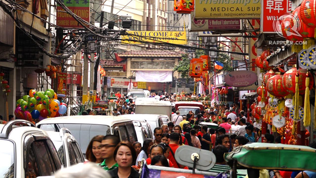 BUSY STREETS. The streets of Chinatown, Binondo are packed with revelers and festival-goers