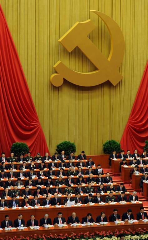 Delegates listen the speech of Chinese president Hu Jintao at the opening of the 18th Communist Party Congress at the Great Hall of the People in Beijing on 08 November 2012. AFP PHOTO/GOH CHAI HIN