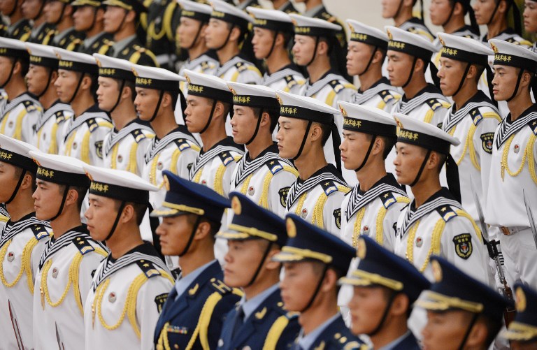 MARITIME POWER. President Hu Jintao said China should become a "maritime power" as he opened a Communist Party congress on Thursday, November 8. In this photo, members of a Chinese honor guard arrive before a meeting between Chinese President Hu Jintao and Egyptian President Mohamed Morsi at the Great Hall of the People in Beijing on August 28, 2012. AFP PHOTO / Mark RALSTON