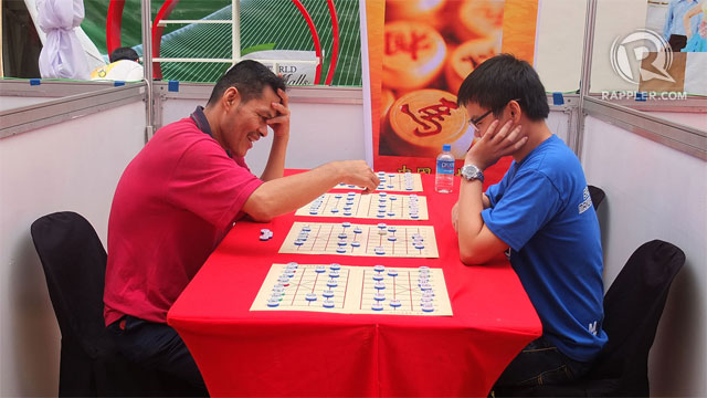 CHECK MATE! Concentration and a good sense of humor is needed for a good game of Chinese Chess