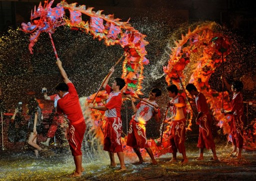 CHEERS. Dragon dancers during Chinese New Year 2012 celebrations. Photo by AFP