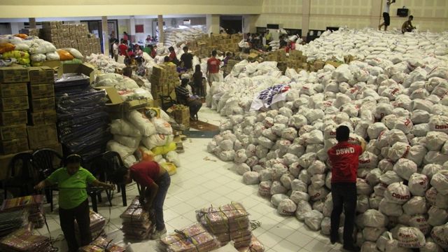 OUTPOURING OF SUPPORT. The Cultural Center of Bohol is turned into a repacking warehouse with goods from DSWD and WFP. Photo by DSWD