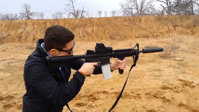 3D MAGAZINE. Defense Distributed shows off an assault rifle using a 3D-printed magazine. Screen shot from YouTube.