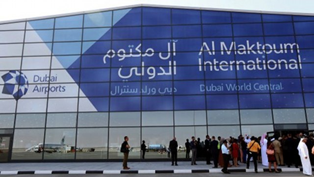 NOW OPEN.  Low cost Kuwaiti al-Jazeera airliner (R) is reflected in the glass of the newly opened Al-Maktoum International airport, the emirate's second airport in Dubai. Photo by AFP