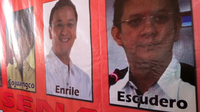 PICTURE TROUBLE. Quimbo's photo was spotted under the name "Enrile" in the poster that featured UNA's top leaders and Senate bets. Photo by Ayee Macaraig.
