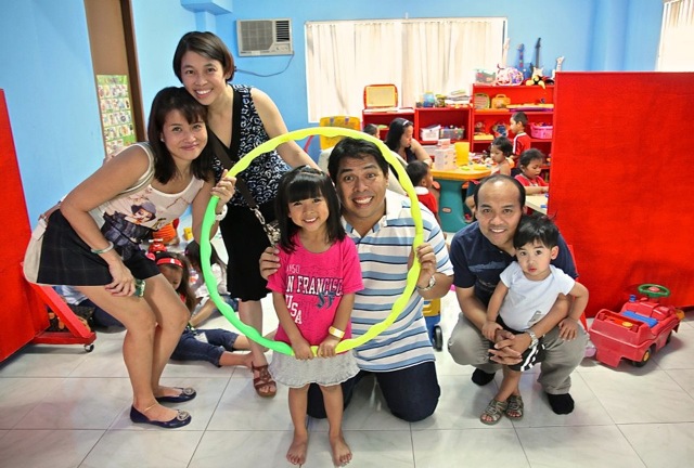 TOY STORY. Edsel Ramirez poses with kids and donors at the Toy Library in Bgy. Loyola Heiights, Quezon City. Photo by Kai Pastores