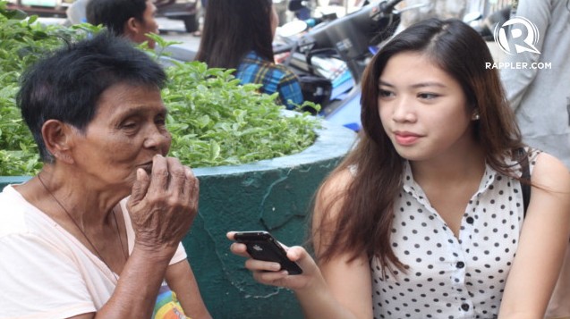 CITIZEN JOURNALISM: Rappler mover Alyza Bordeos interviews a mock voter for the coverage of the Dumaguete City mock polls. Photo by Kimberly Limpahan.