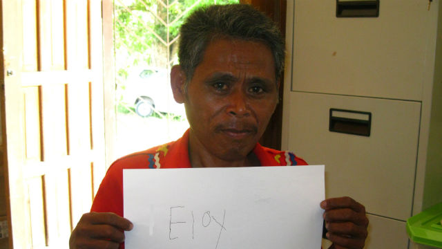 DEDICATED. Eloy proudly shows off his biggest achievement: writing his own name. Photo from DSWD. 