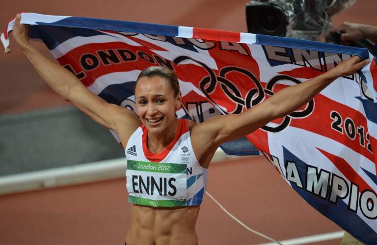 Britain's Jessica Ennis waves her national flag as she celebrates winning the women's heptathlon at the athletics event during the London 2012 Olympic Games on August 4, 2012 in London. AFP PHOTO / BEN STANSALL