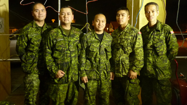 COMING HOME TO THIER COUNTRY IN NEED. Major Jay Manimtim (extreme right) and some of the other Filipino-Canadian officers of the Canadian Forces Disaster Assistance Response Team.