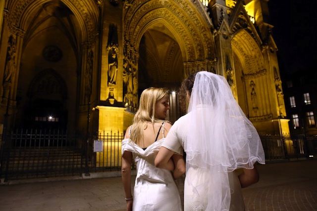 GAY MARRIAGE. Members of the efFRONTe-e-s collective pose during a fake wedding as part of a gay-friendly and pro-secular happening, on October 30, 2012, in front of Sainte-Clothilde Basilica in Paris. AFP PHOTO /THOMAS SAMSON