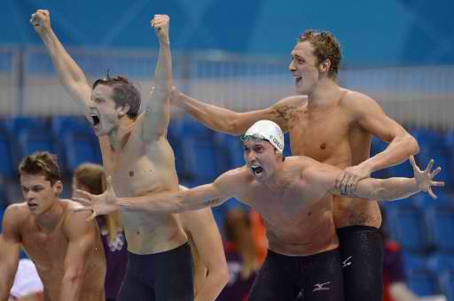 CELEBRATION. The  France men's 4x100m freestyle relay team celebrates after defeating the USA on the final leg. AFP.