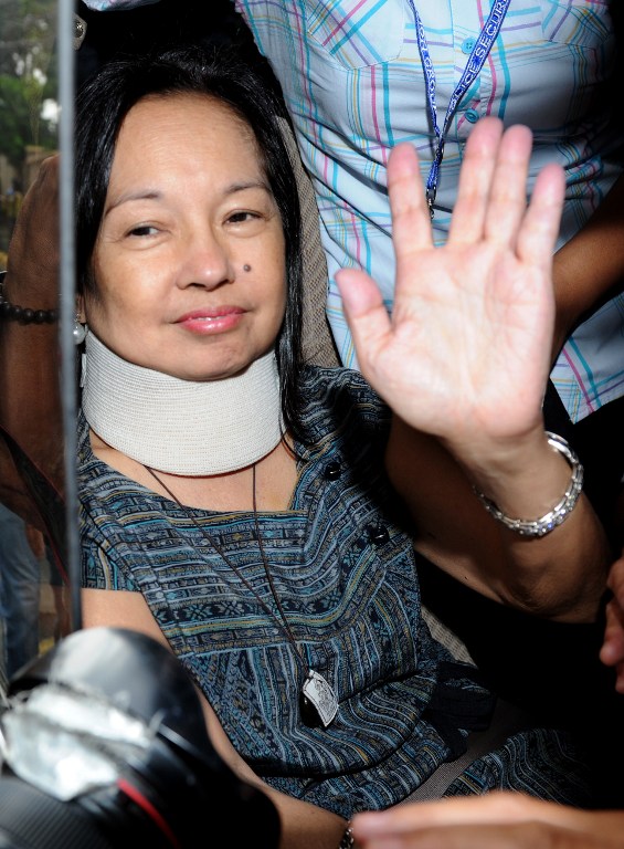 This file photo taken on July 25, 2012, shows former Philippine president Gloria Arroyo waving to her supporters after being released from hospital arrest at a military hospital in Manila. AFP PHOTO / FILES / NOEL CELIS