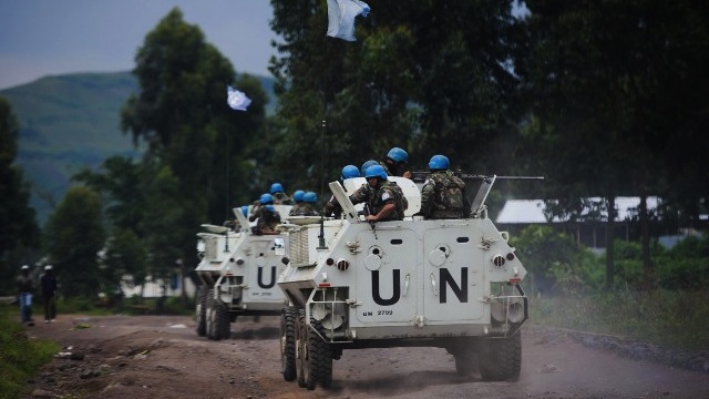 TENSIONS IN GOMA. United Nations armored personnel carriers drive towards a UN base in Monigi, 5kms from Goma, in eastern Democratic Republic of the Congo, on November 18, 2012. AFP PHOTO / PHIL MOORE