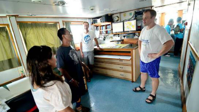 ONLY FILIPINO. Frederick Ventura Bangad converses with co-defenders inside the campaign vessel. Photo by Romualdo Señeris Jr