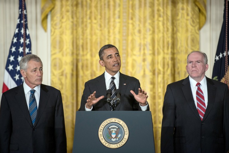 OBAMA'S PICKS. Chuck Hagel (L) and John Brennan (R) listen while US President Barack Obama speaks during an event in the East Room of the White House January 7, 2013 in Washington, DC. AFP PHOTO/Brendan SMIALOWSKI