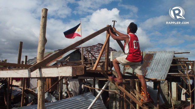 REBUILDING. Residents rebuild their homes twelve days after Typhoon Yolanda hit the town of Palo, Leyte. Photo by Jake Verzosa