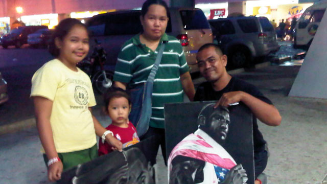 WORK OF ART. Alfonso and his family pose with his LeBron artwork. Photo by Rappler/Myke Miravite.