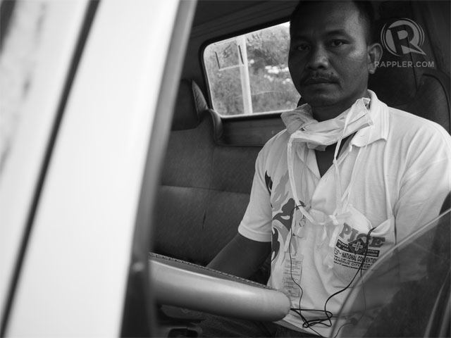 IN SERVICE. Sunny Boy Arriola inside his city-issued truck. 27 Sep 2013 Photo by Paolo Villaluna