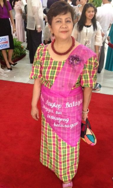 GABRIELA REP. LUZ ILAGAN wore a green and pink checkered Bayanihan with an 'alampay' and 'tapis' that reveal a call for women’s access to healthcare. Photo by Carlos Santamaria