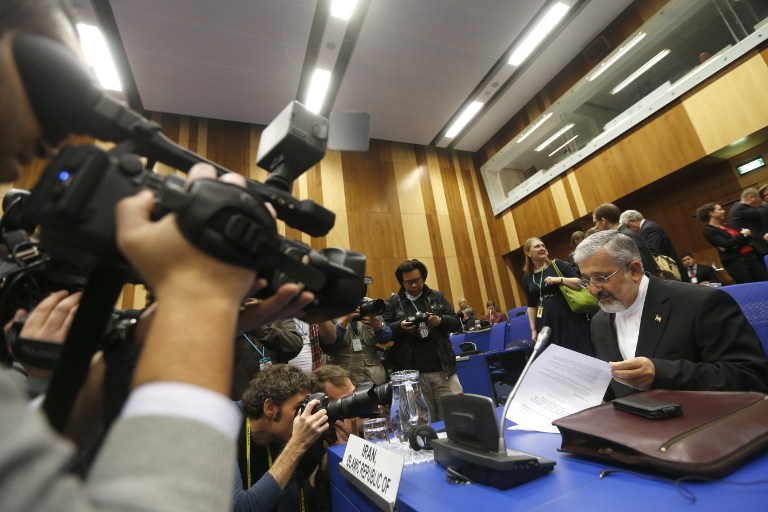 Iran's envoy to the International Atomic Energy Agency (IAEA) Ali Asghar Soltanieh (R) is filmed upon arrival at the IAEA Board of Governors meeting at the UN atomic agency headquarters in Vienna on November 29, 2012. AFP PHOTO / ALEXANDER KLEIN