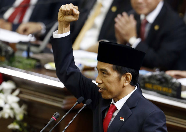 FREEDOM! President Joko Widodo pumps his fist as he closes his inauguration speech on Monday, October 20, by saying 'Merdeka!' Photo by EPA