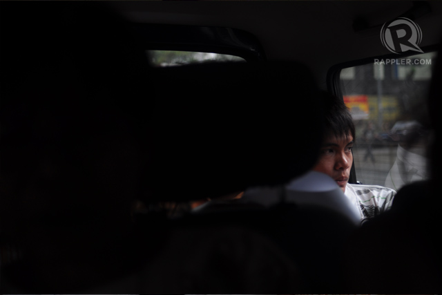 JOLLIBEE. Witness Wilfredo Ramos Jr, known as Jollibee, looks out the window on the way to testify against military operatives. Photo by Geloy Concepcion 2011