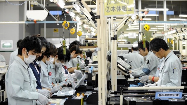 REVIVAL? Workers are seen at an assembly line of a laptop computer factory in Kobe, Western Japan. February 2012 file photo by EPA
