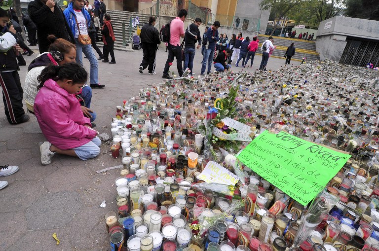 IN MOURNING. Fans of Mexican-US singer Jenni Rivera remain next to hundreds of candles outside the Arena Monterrey, where she performed her last show, in Monterrey, Nuevo Leon state, Mexico on December 10, 2012. AFP PHOTO /STR