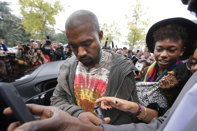 DON'T MAKE ME ANGRY. Kanye West signing autographs in Paris. Photo: Joel Saget/AFP