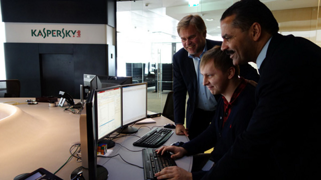 TEAM UP. Eugene Kaspersky shows the Kaspersky Lab to Ronald Noble of INTERPOL. Photo from Kaspersky Lab