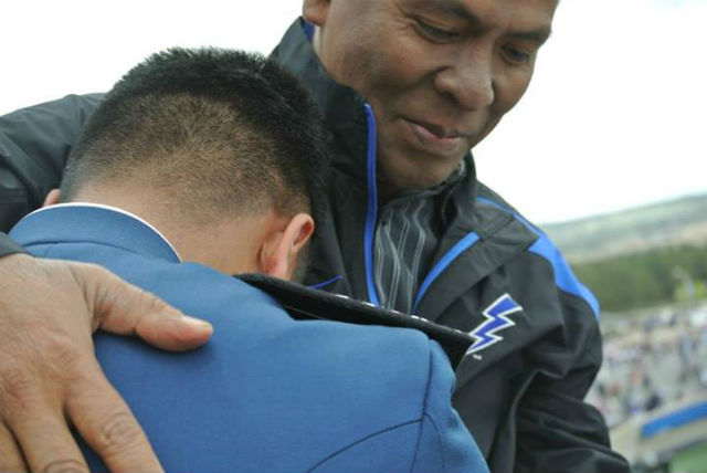 FATHER AND SON. A poignant moment between USAFA alumnus Ken Quijano and his dad after Ken’s graduation rites on May 29. Photo by Suzzane Quira