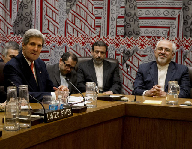 UNPRECEDENTED TALKS. US Secretary of State John Kerry (L) and Iran's Foreign Minister Mohammad-Javad Zarif (R) attend a meeting to discuss Iran's suspect nuclear program September 26, 2013 on the sidelines of the General Assembly at UN headquarters in New York. AFP PHOTO/Stan Honda