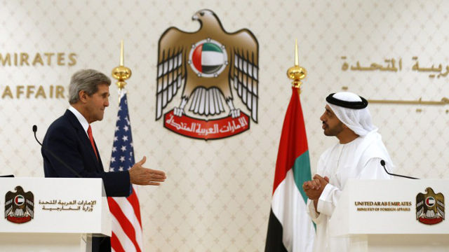 SHAKING HANDS. U.S. Secretary of State John Kerry reaches out to shake hands with UAE Foreign Minister Abdullah bin Zayed Al Nahyan in Abu Dhabi, November 11, 2013. AFP PHOTO / JASON REED / POOL
